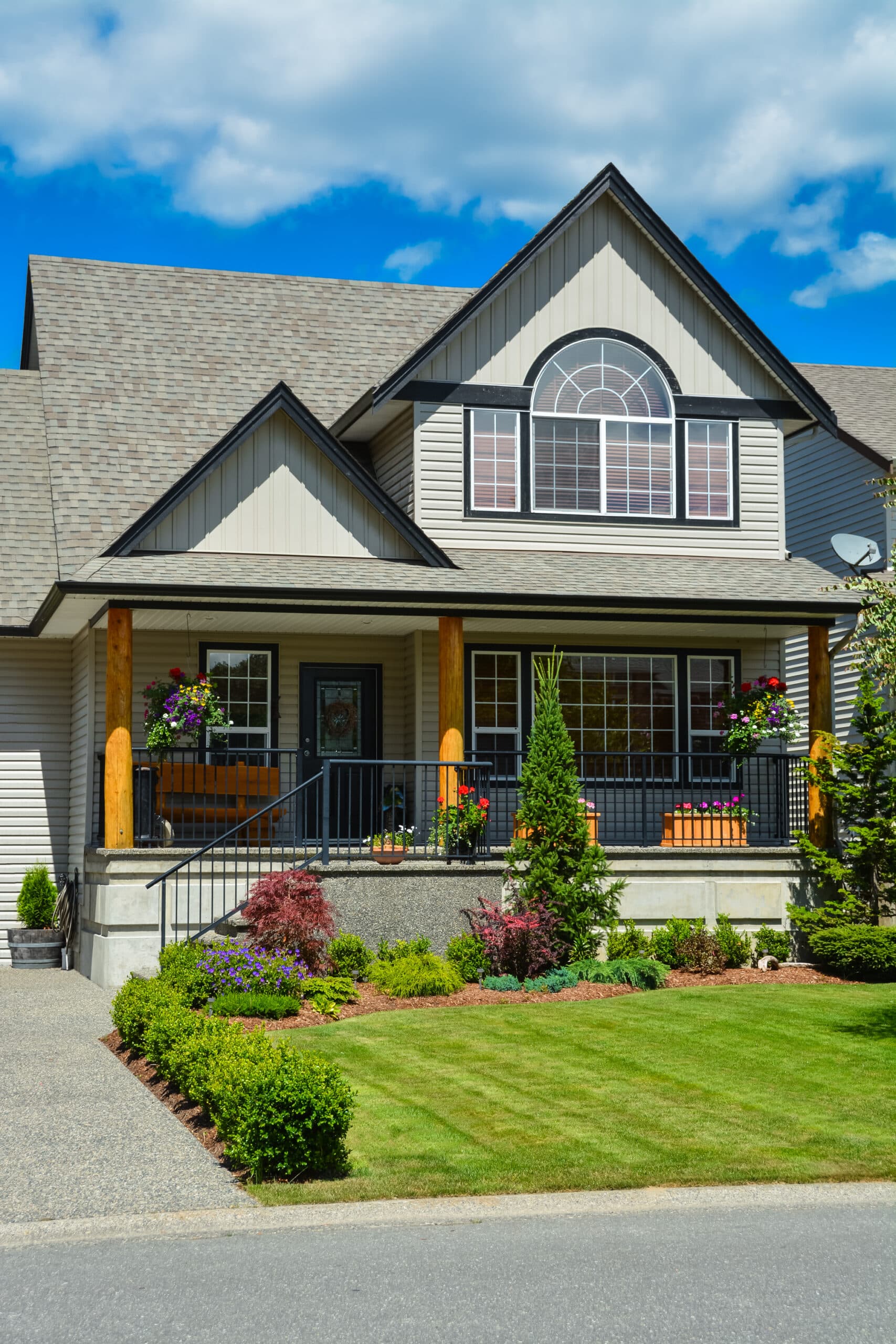 Suburban house with landscaping in front and blue sky background. Suburban house with landscaping in front and blue sky background